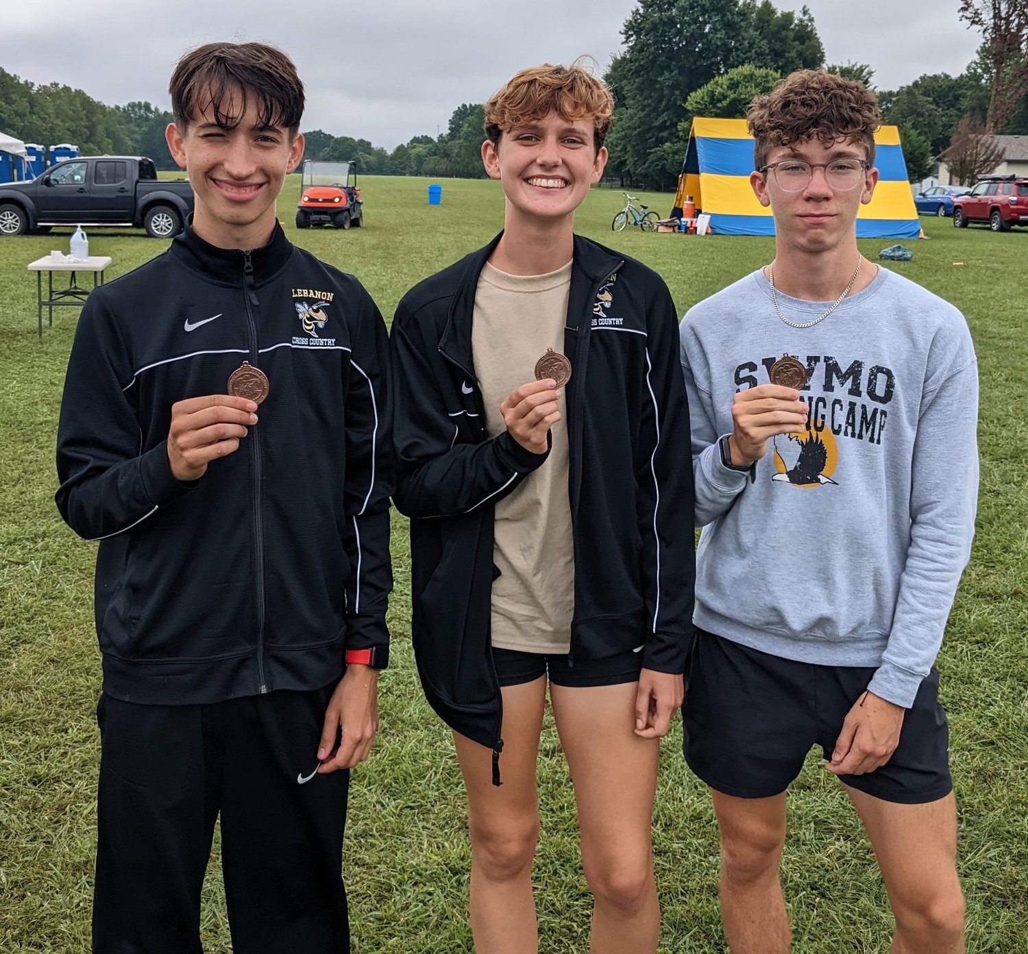 The Lebanon High School cross country team had three medalists at the Bolivar Invitational. Pictured from left, are Chris Wadley, Ella Johnson, and Peter Stunja.